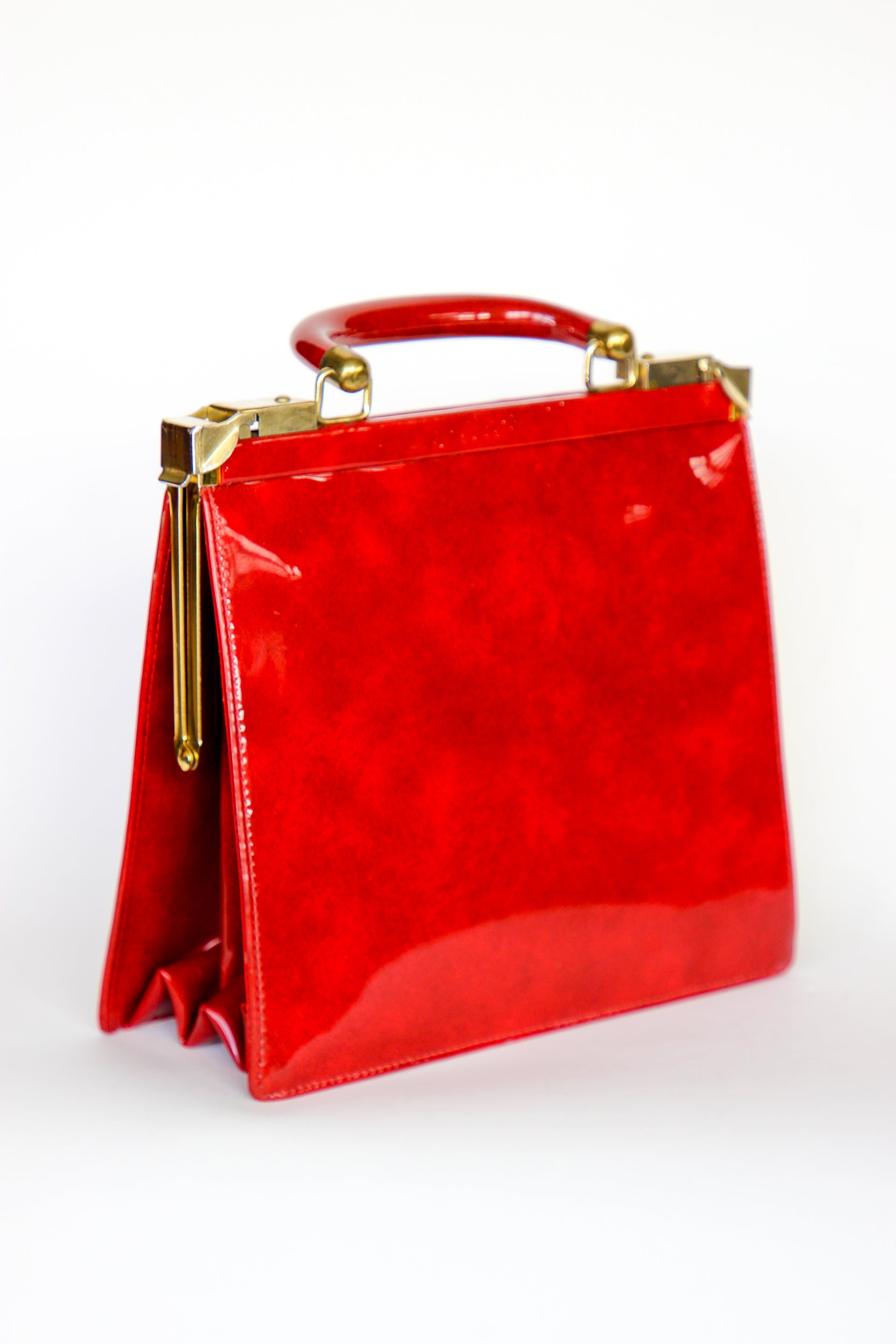 1960s Vintage Red Vinyl Top Handle Bag/Purse with Golden Closure.