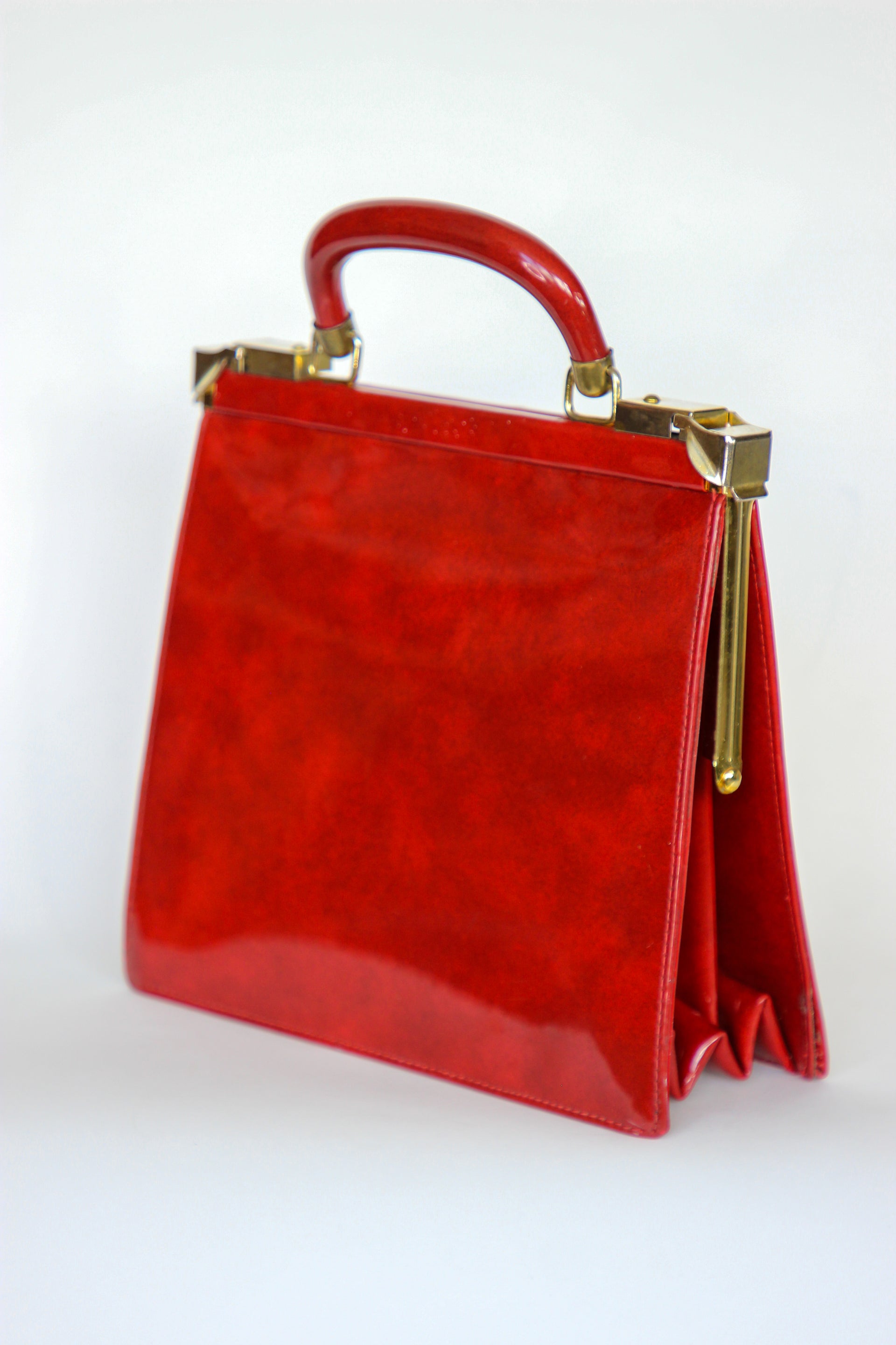 1960s Vintage Red Vinyl Top Handle Bag/Purse with Golden Closure.