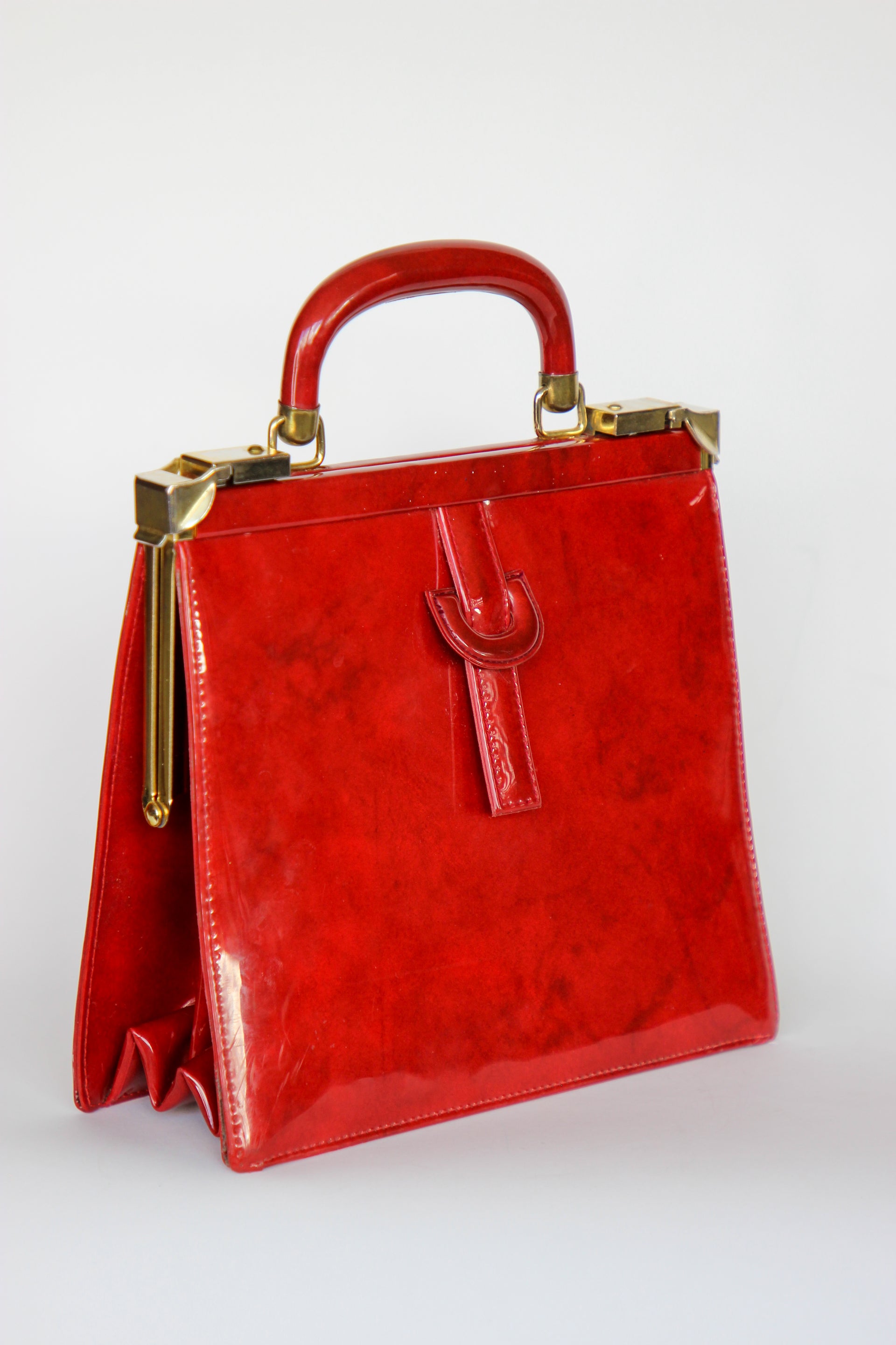 1960s Vintage Red Vinyl Top Handle Bag/Purse with Golden Closure.