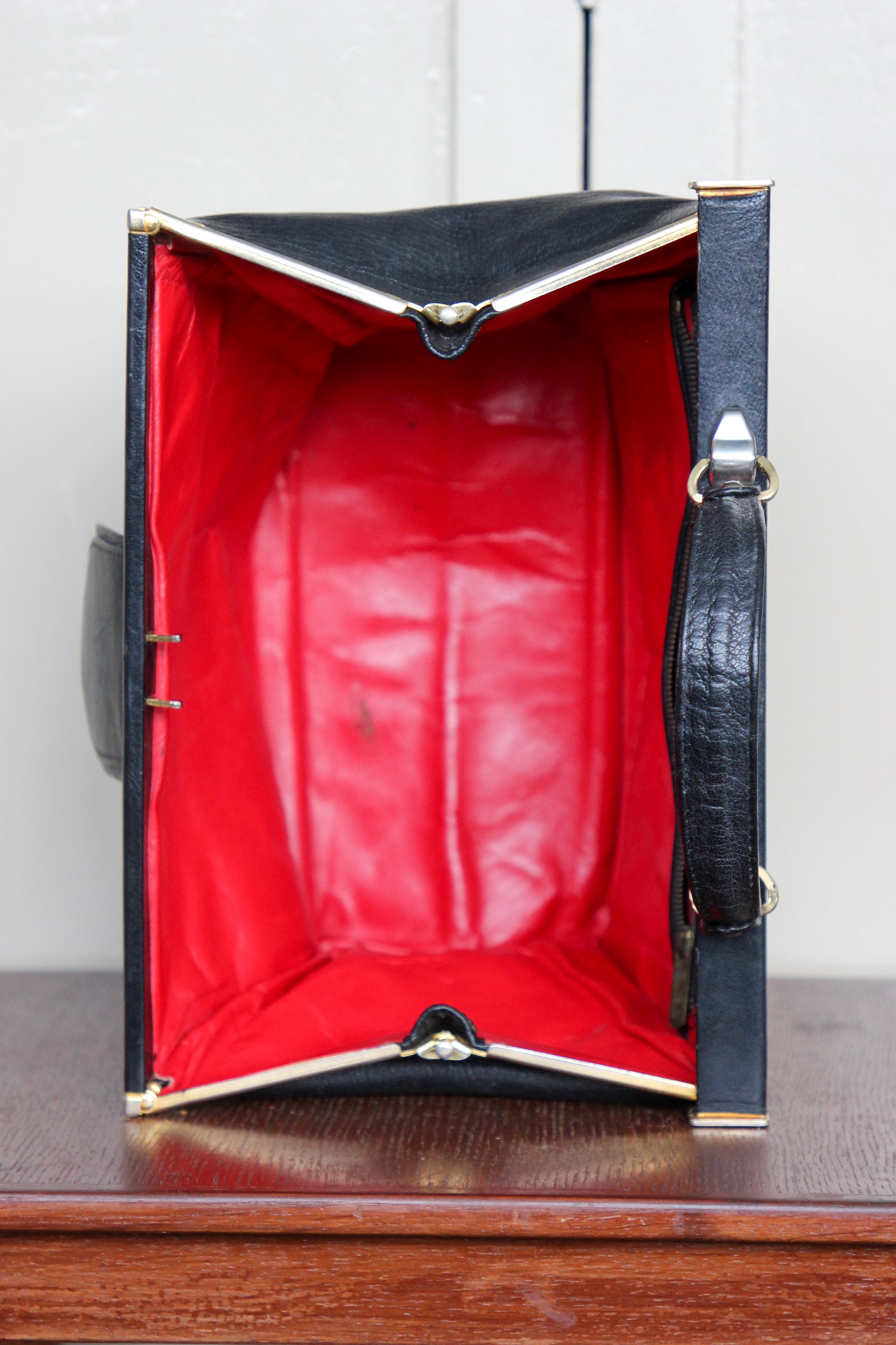 B141 1960s Vintage Black Leather Top Handle Bag with Red Linen