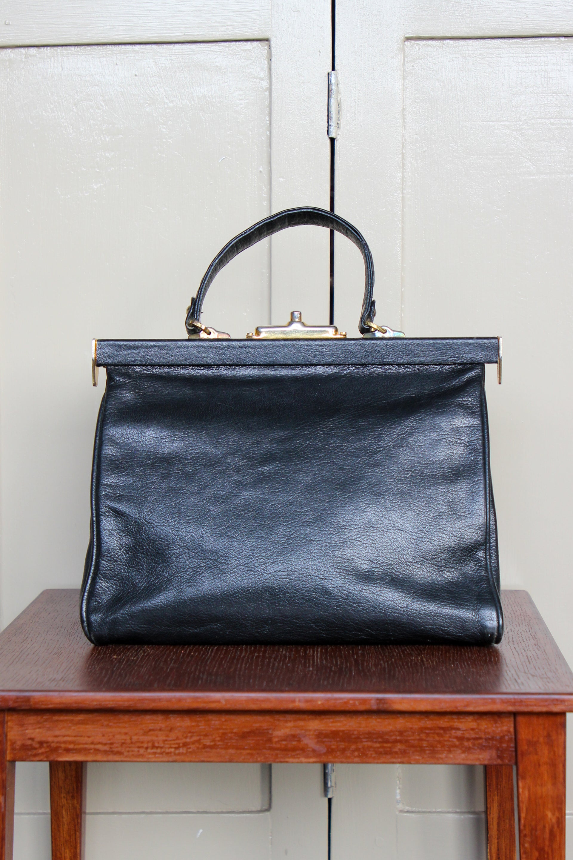 B141 1960s Vintage Black Leather Top Handle Bag with Red Linen