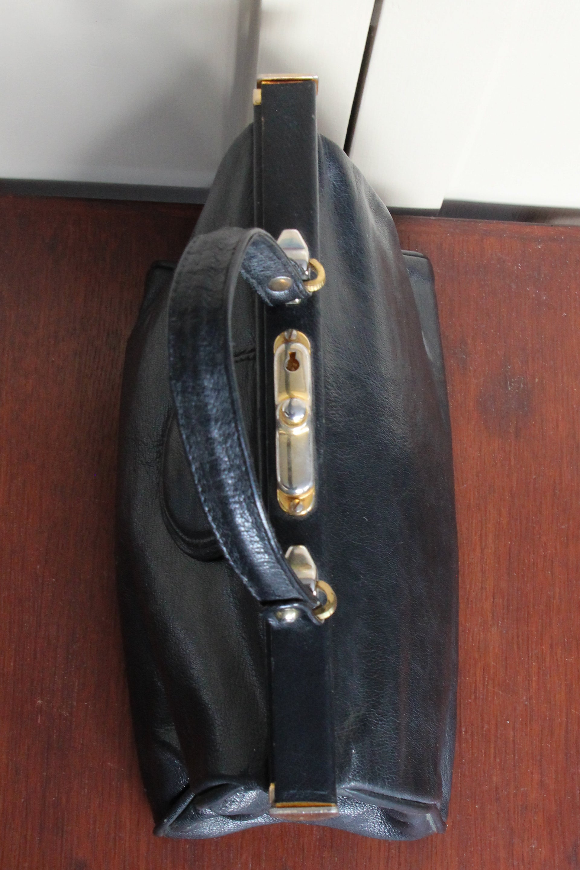 B141 1960s Vintage Black Leather Top Handle Bag with Red Linen